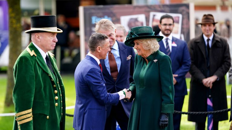 Her Majesty The Queen greets Frankie Dettori before the unveiling of a statue to commemorate the legendary jockey at Ascot