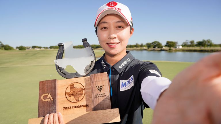 Hyo Joo Kim celebrates with her trophy after winning The Ascendant LPGA Benefiting Volunteers of America