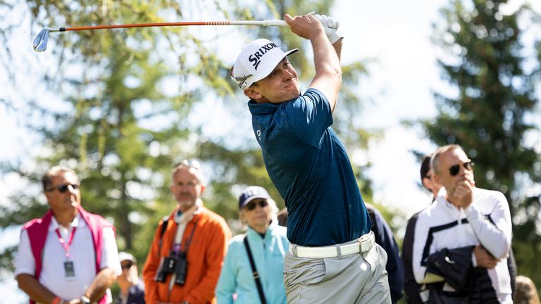 John Catlin of the USA, tees off during the fourth round of the Omega European Masters Golf Tournament in Crans-Montana, Switzerland, Sunday, Aug. 29, 2021. (Peter Klaunzer/Keystone via AP)