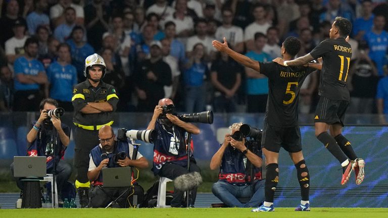 Real Madrid&#39;s Jude Bellingham, 2nd right, celebrates with Real Madrid&#39;s Rodrygo after scoring his sides second goal during the Champions League group C soccer match between Napoli and Real Madrid at the Diego Armando Maradona stadium in Naples, Italy, Tuesday, Oct. 3, 2023. (AP Photo/Alessandra Tarantino)