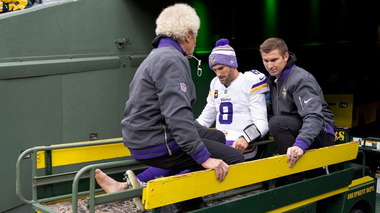 Minnesota Vikings quarterback Kirk Cousins (8) is carted off the field after sustaining an injury during the second half of an NFL football game against the Green Bay Packers, Sunday, Oct. 29, 2023, in Green Bay, Wis. (Carlos Gonzalez/Star Tribune via AP)