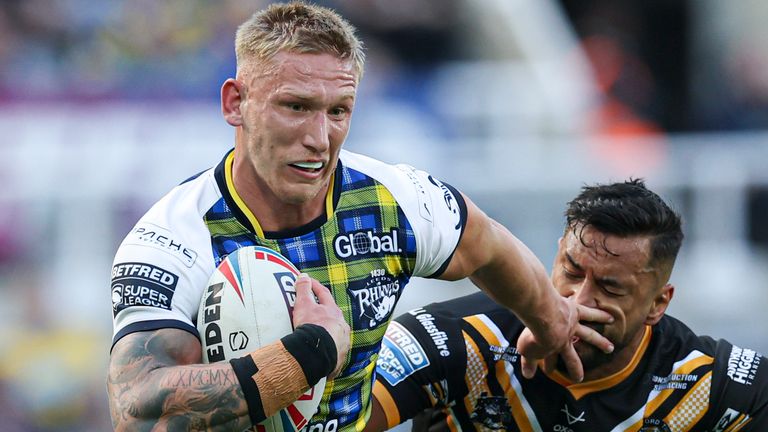 Picture by Paul Currie/SWpix.com - 03/06/2023 - Rugby League - Betfred Super League Magic Weekend - Leeds Rhinos v Castleford Tigers - St. James' Park, Newcastle, England - Leeds Rhinos' Mikolaj Oledzki is tackled by Castleford Tigers' Kenny Edwards