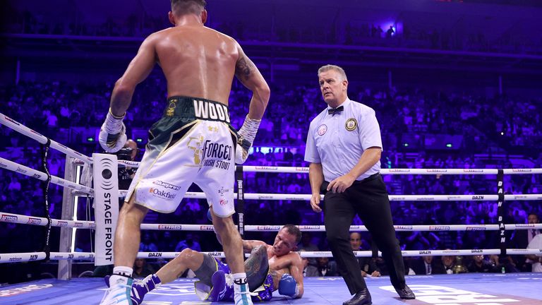 Leigh Wood came back to knock Josh Warrington down in the seventh round and retain his WBA World Featherweight title