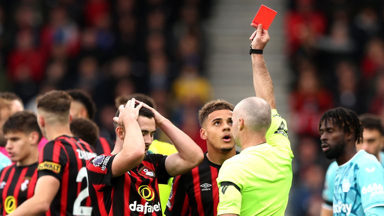 Bournemouth's Lewis Cook is shown a red card