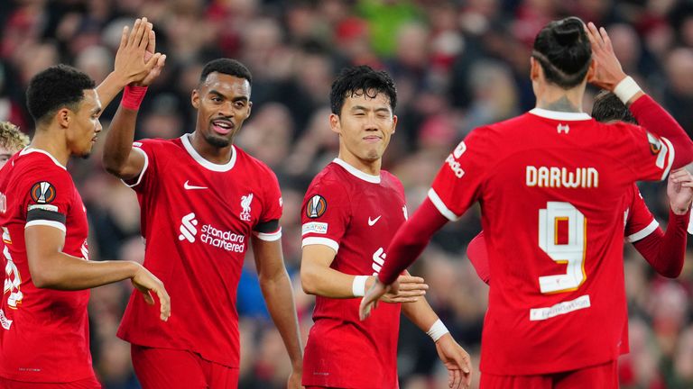 Liverpool's Wataru Endo, centre, celebrates after scoring his side's second goal during the Europa League Group E soccer match between Liverpool and Toulouse, at Anfield in Liverpool, England, Thursday, Oct. 26, 2023. (AP Photo/Jon Super)