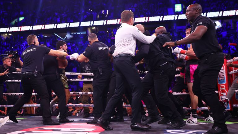 Security enters the ring to break up Logan Paul and Dillon Danis during the Misfits Heavyweight fight between Logan Paul and Dillon Danis at AO Arena on October 14, 2023 in Manchester, England. (Photo by Matt McNulty/Getty Images)