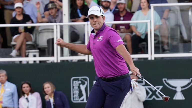 Luke List leaps as he sinks a 43-foot putt for birdie on No. 18  to win the Sanderson Farms Championship golf tournament Sunday, Oct. 8, 2023, in Jackson, Miss. (AP Photo/Rogelio V. Solis)