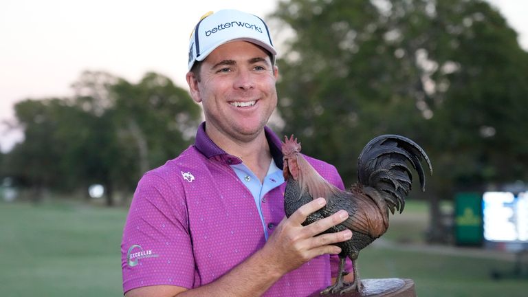 Luke List holds the winner's trophy after his victory in the Sanderson Farms Championship golf tournament, Sunday, Oct. 8, 2023, in Jackson, Miss. (AP Photo/Rogelio V. Solis)