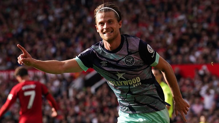 Mathias Jensen celebrates scoring at Old Trafford