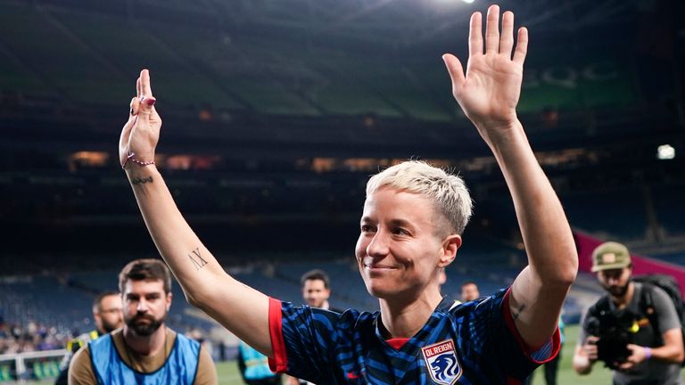 Megan Rapinoe waves as she walks off the OL Reign pitch for the final time