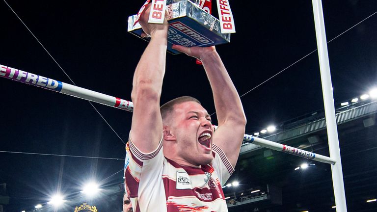 Picture by Allan McKenzie/SWpix.com - 14/10/2023 - Rugby League - Betfred Super League Grand Final - Wigan Warriors v Catalans Dragons - Old Trafford, Manchester, England - Morgan Smithies celebrates to fans with the Betfred Super League trophy.