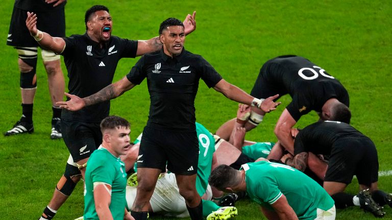 New Zealand players celebrate after winning the Rugby World Cup quarterfinal match between Ireland and New Zealand at the Stade de France in Saint-Denis, near Paris, Saturday, Oct. 14, 2023. (AP Photo/Themba Hadebe)