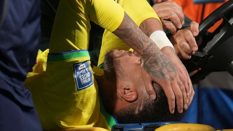 Brazil's Neymar is carried off the pitch on a stretcher after being injured during a qualifying soccer match for the FIFA World Cup 2026 against Uruguay at Centenario stadium in Montevideo, Uruguay, Tuesday, Oct. 17, 2023. (AP Photo/Matilde Campodonico)