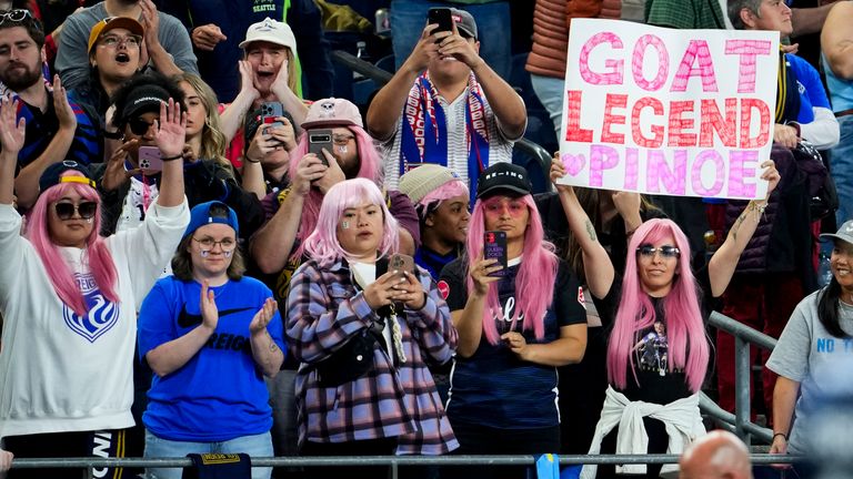 Fans wear pink wigs for OL Reign forward Megan Rapinoe