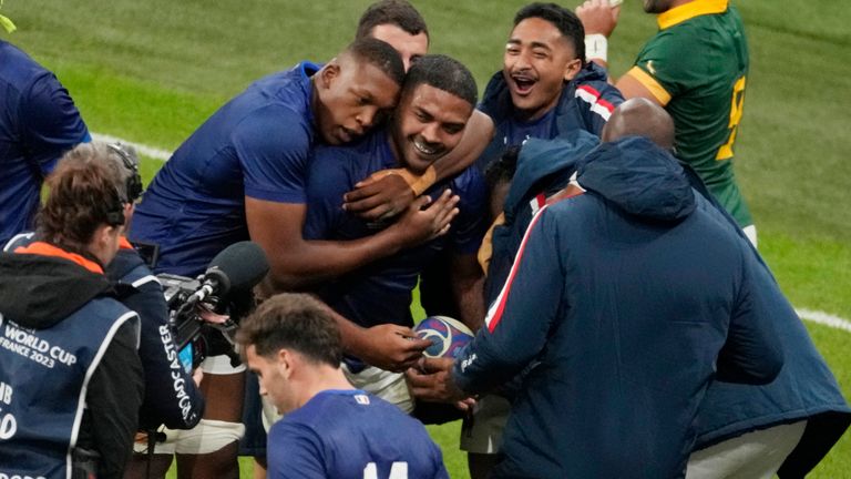 France's team celebrate after Peato Mauvaka scored a try during the Rugby World Cup quarterfinal match between France and South Africa at the Stade de France in Saint-Denis, near Paris, Sunday, Oct. 15, 2023. (AP Photo/Themba Hadebe)