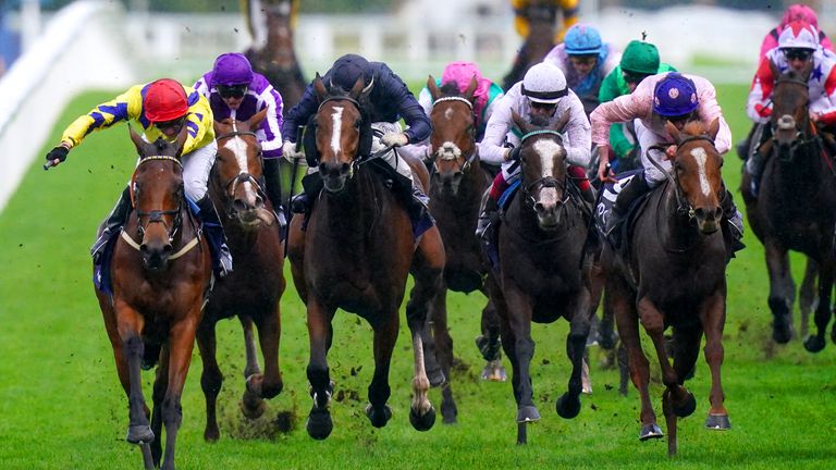 Poptronic (red cap) holds on to win the Fillies & Mares at Ascot under Sam James