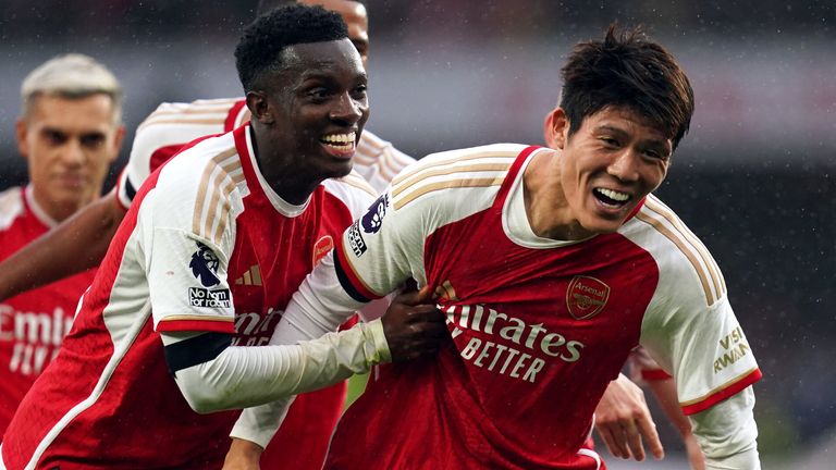 Takehiro Tomiyasu is mobbed by his team-mates after scoring Arsenal's fifth goal against Sheffield United