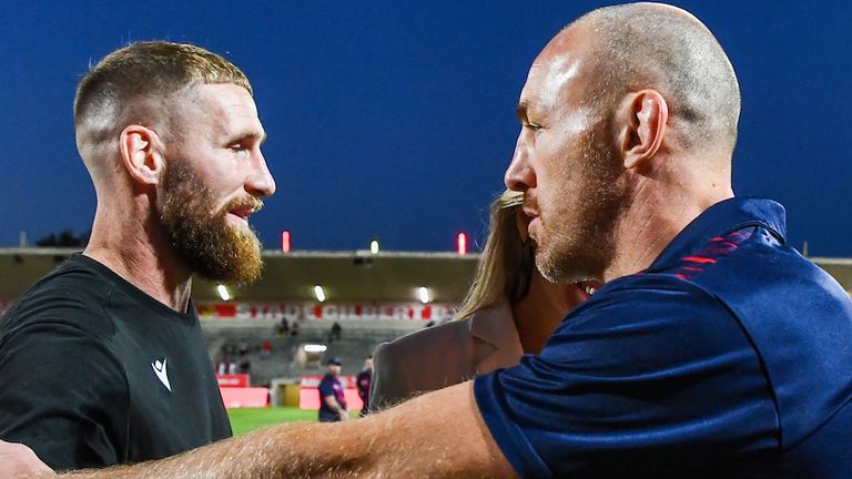 Picture by Olly Hassell/SWpix.com - 06/10/2023 - Rugby League - Betfred Super League Semi-final - Catalans Dragons v St Helens - Stade Gilbert Brutus, Perpignan, France - St Helens' James Roby and Catalans' Sam Tomkins shaking hands before kick off at the Stade Gilbert Brutus