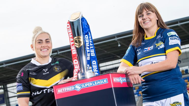 Picture by Allan McKenzie/SWpix.com - 28/09/2023 - Rugby League - Betfred Women's Super League - Women's Grand Final Preview - LNER Community Stadium, York, England - York and Leeds' captains Sinead Peach & Hanna Butcher with the Women's Betfred Super League trophy.
