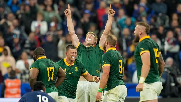 South African players celebrate as they defeat France at the end of the Rugby World Cup quarterfinal match between France and South Africa at the Stade de France in Saint-Denis, near Paris Sunday, Oct. 15, 2023. (AP Photo/Christophe Ena)