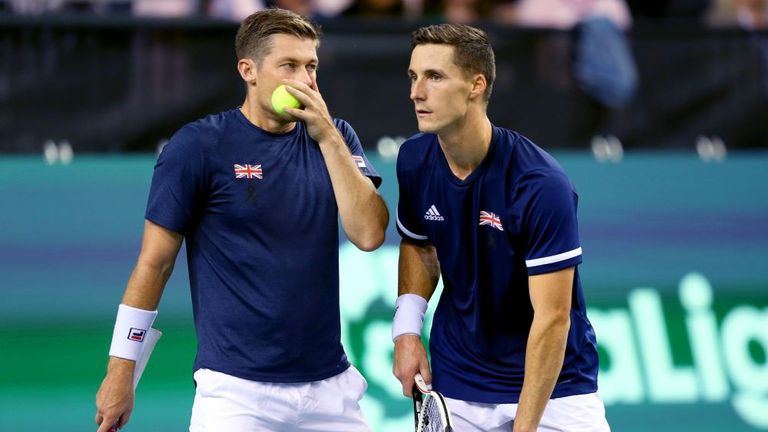 Neal Skupski (left) and Joe Salisbury (right) confer in their doubles match against Kazakhstan in the Davis Cup Group Stages