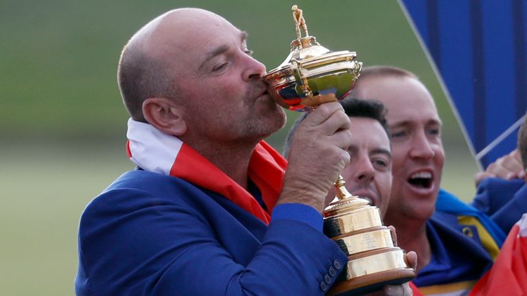 Europe team captain Thomas Bjorn kisses the cup during the trophy presentation after the European team won the 2018 Ryder Cup golf tournament at Le Golf National in Saint Quentin-en-Yvelines, outside Paris, France, Sunday, Sept. 30, 2018. (AP Photo/Alastair Grant)..