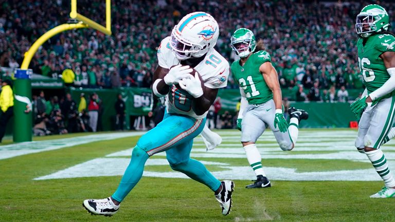 Miami Dolphins wide receiver Tyreek Hill (10) catches the ball for a touchdown during the first half of an NFL football game against the Philadelphia Eagles on Sunday, Oct. 22, 2023, in Philadelphia. (AP Photo/Matt Rourke)
