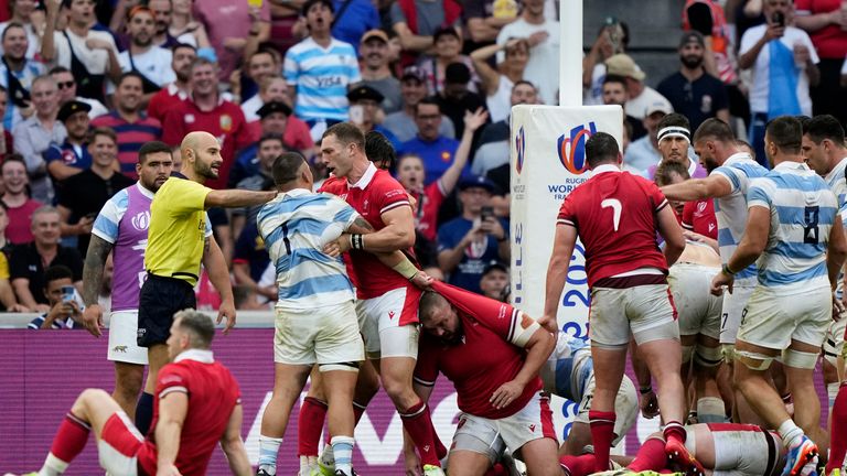 Players fight among themselves during the Rugby World Cup quarterfinal match between Wales and Argentina at the Stade de Marseille in Marseille, France, Saturday, Oct. 14, 2023. (AP Photo/Lewis Joly)