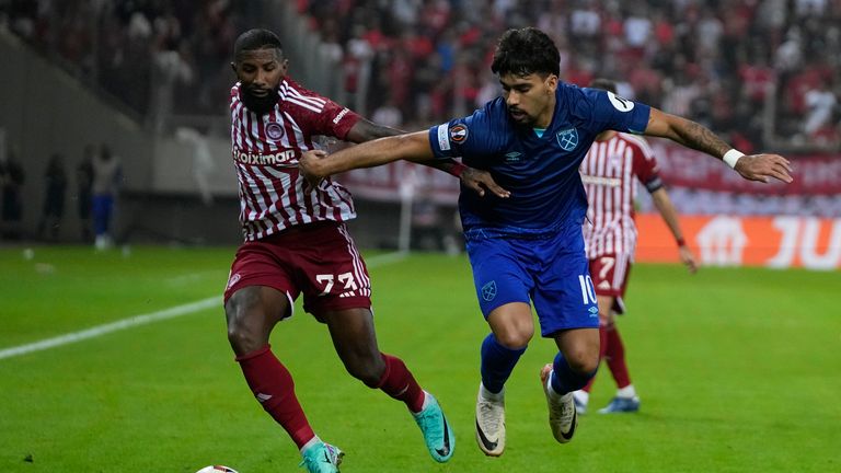 Olympiacos' Rodinei, left, and West Ham's Lucas Paqueta fight for the ball during the Group A Europa League soccer match between Olympiacos and West Ham at Georgios Karaiskakis stadium in the port of Piraeus, near Athens, Greece, Thursday, Oct. 26, 2023. (AP Photo/Thanassis Stavrakis)