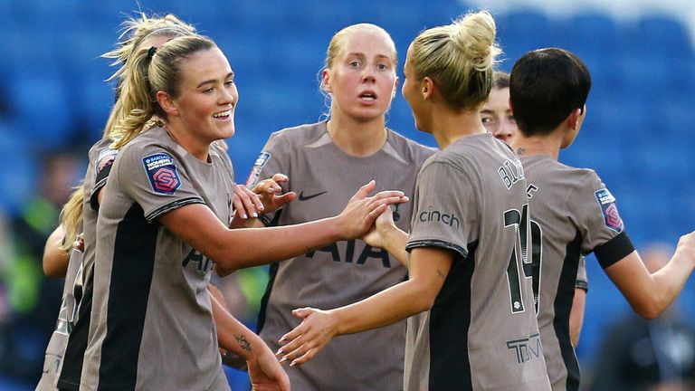 Grace Clinton celebrates with her team-mates after giving Spurs a 2-1 lead at Brighton