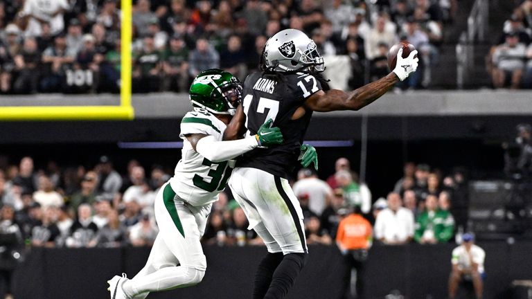 Las Vegas Raiders wide receiver Davante Adams (17) catches a pass as New York Jets cornerback Michael Carter II defends during the first half of an NFL football game Sunday, Nov. 12, 2023, in Las Vegas.