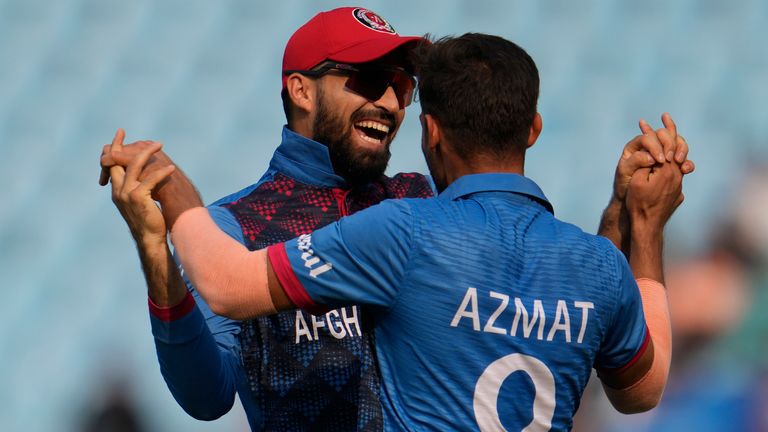 Afghanistan's captain Hashimatullah Shahidi celebrates the wicket of wicket of Netherlands' Max O'Dowd with teammate Azmatullah Omarzai during the ICC Men's Cricket World Cup match between Afghanistan and Netherlands in Lucknow, India, Friday, Nov. 3, 2023. (AP Photo/Altaf Qadri)