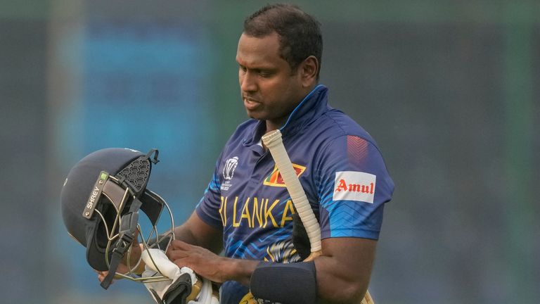 Sri Lanka's Angelo Mathews walks off the field after being declared timed out against Bangladesh (Associated Press)