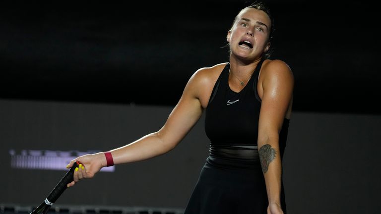 Aryna Sabalenka, of Belarus, reacts after losing a point to Iga Swiatek, of Poland, during a women's singles semifinal match at the WTA Finals tennis championships, in Cancun , Mexico, Sunday, Nov. 5, 2023. (AP Photo/Fernando Llano)