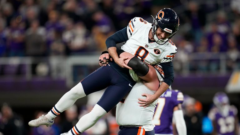 Chicago Bears place-kicker Cairo Santos (8) celebrates with teammate guard Lucas Patrick after kicking a 30-yard field goal during the second half of an NFL football game against the Minnesota Vikings, Monday, Nov. 27, 2023, in Minneapolis. The Bears won 12-10.