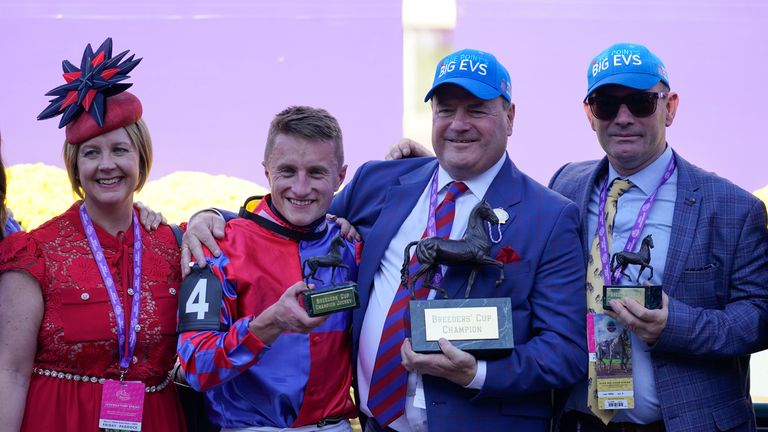 Tom Marquand, second from left, poses with owners Rachael Teasdale, left, and Paul Teasdale, second from right, and trainer Michael Appleby, right, after riding Big Evs to win the Breeders' Cup Juvenile Turf Sprint