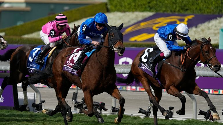 William Buick and Master of the Seas, blue cap, beat Mawj and Oisin Murphy to win the Breeders' Cup Mile