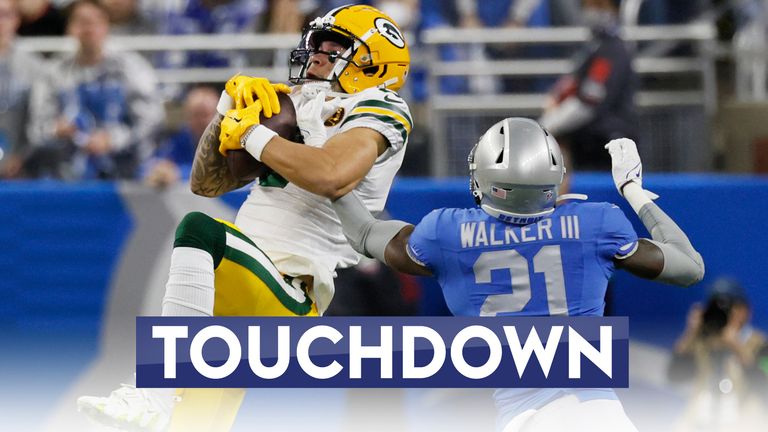 Green Bay Packers wide receiver Christian Watson (9) defended by Detroit Lions safety Tracy Walker III (21), catches a pass during the first half of an NFL football game, Thursday, Nov. 23, 2023, in Detroit. (AP Photo/Duane Burleson)



