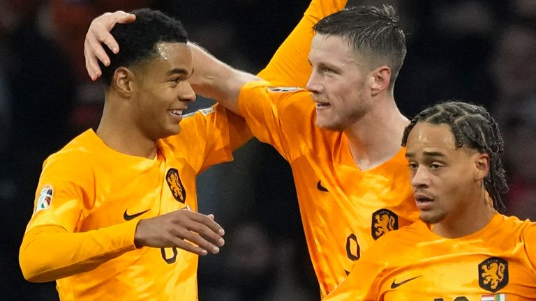 Cody Gakpo (left) congratulates Wout Weghorst (centre) for scoring the opening goal for the Netherlands against the Republic of Ireland