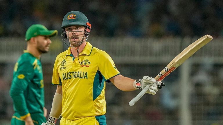 Australia's Travis Head raises his bat as he celebrates after a 40-ball fifty against South Africa 
