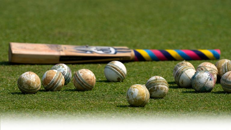 Cricket balls and a bat is seen on the ground before the start of ICC Men&#39;s Cricket World Cup match between New Zealand and South Africa 