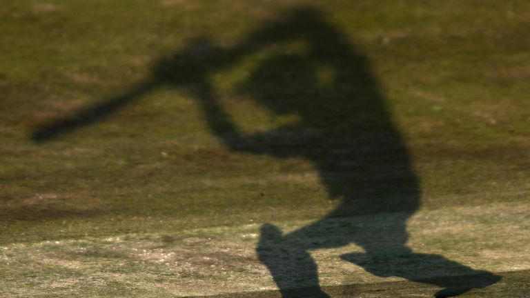 Shadow of cricketer in nets