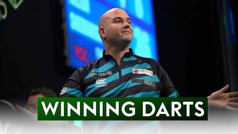 Rob Cross secured his progress to the Second Round of the Grand Slam of Darts with a win over Fallon Sherrock in Group G.