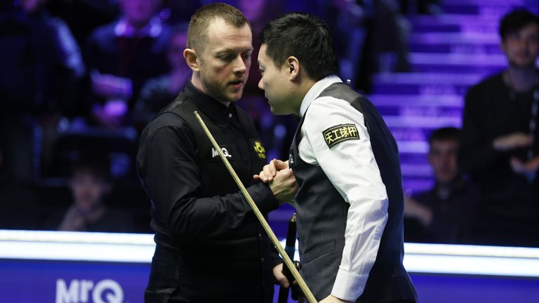 Mark Allen (left) shakes hands with Ding Junhui on day one of the MrQ UK Championship 2023 at York Barbican. Picture date: Saturday November 25, 2023.