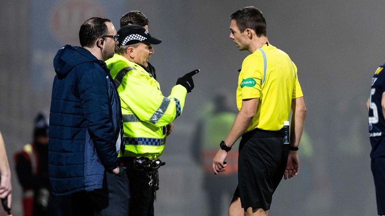 DUNDEE, SCOTLAND - NOVEMBER 01: Referee Kevin Clancy speaks with a Police officer during a cinch Premiership match between Dundee FC and Rangers at The Scot Foam Stadium at Dens Park, on November 01, 2023, in Dundee, Scotland.  (Photo by Ross Parker / SNS Group)