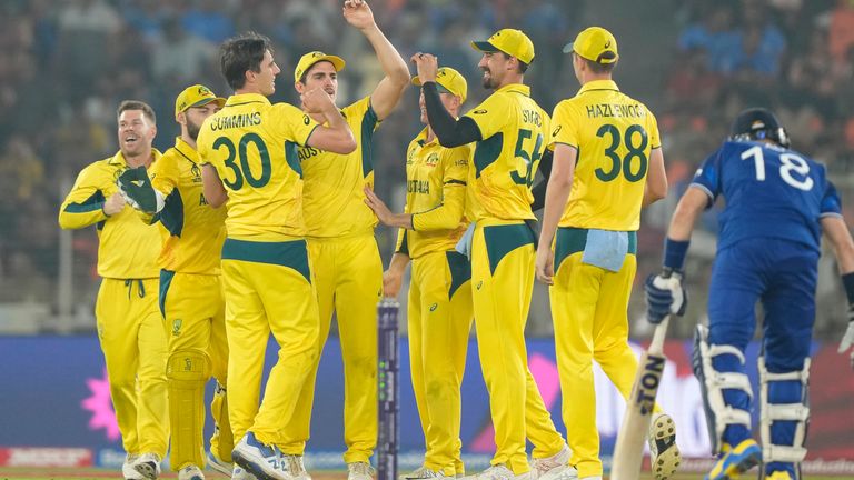 Australian cricketers celebrate the dismissal of England's Liam Livingstone