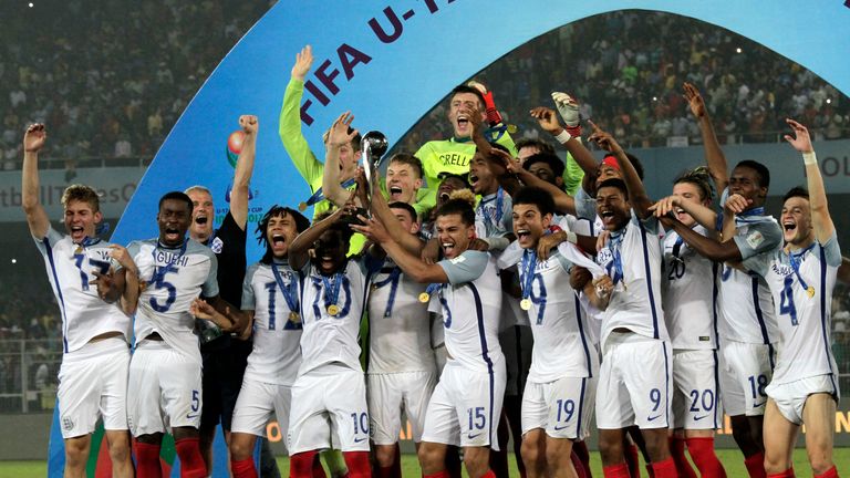 England football players celebrate with winning trophy during the FIFA U-17 World Cup final match  in Kolkata, India, Saturday, Oct. 28, 2017. (AP Photo/Bikas Das).