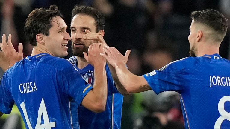 Italy's Federico Chiesa, left, celebrates with his teammates Italy's Giacomo Bonaventura and Jorginho after scoring his sides second goal during an Euro 2024 group C qualifying soccer match between Italy and North Macedonia, at the Olympic Stadium stadium in Rome Friday, Nov. 17, 2023. (AP Photo/Andrew Medichini)