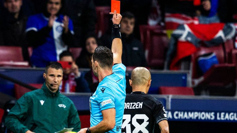 Referee Ivan Kruzliak shows a red card to Celtic&#39;s Daizen Maeda during a UEFA Champions League group stage match between Atletico de Madrid and Celtic