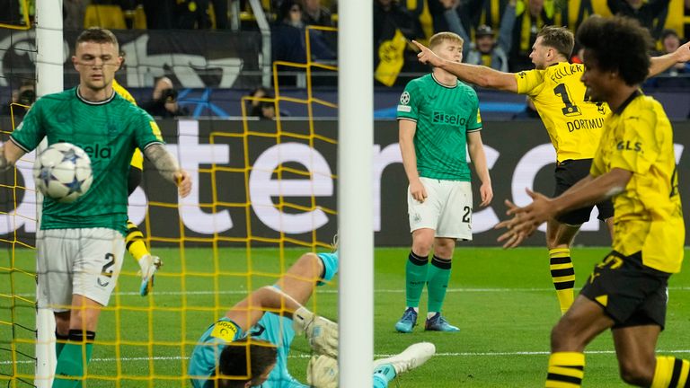 Dortmund's Niclas Fuellkrug is seen in the background, celebrates after scoring against Newcastle during the Champions League Group F match